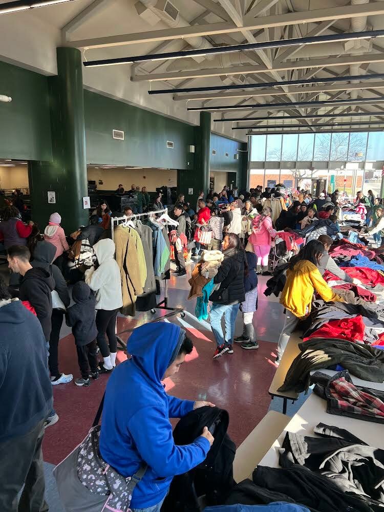 Hundreds turned out to “shop” for warm winter coats donated to Helpsy for use in Coat Giveaway and Holiday Event organized by William Floyd United Teachers.